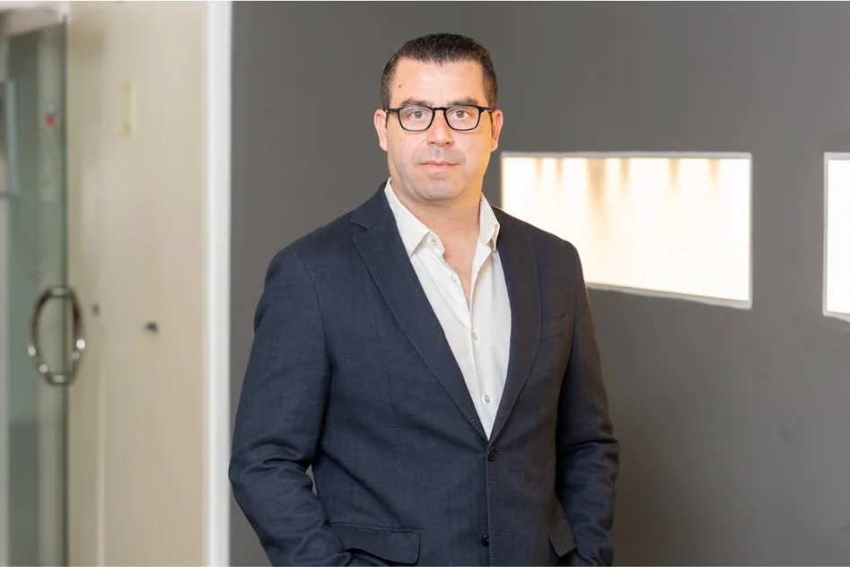 Portrait of a BY KENAN team member in a modern office